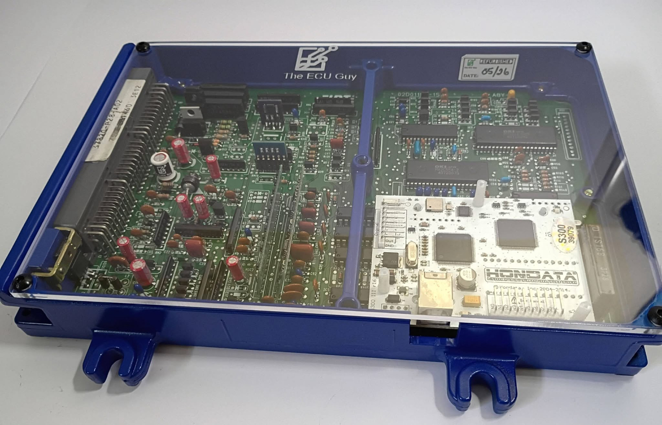 A refurbished Honda ECU in a blue anodized The ECU Guy case with a Hondata S300 installed